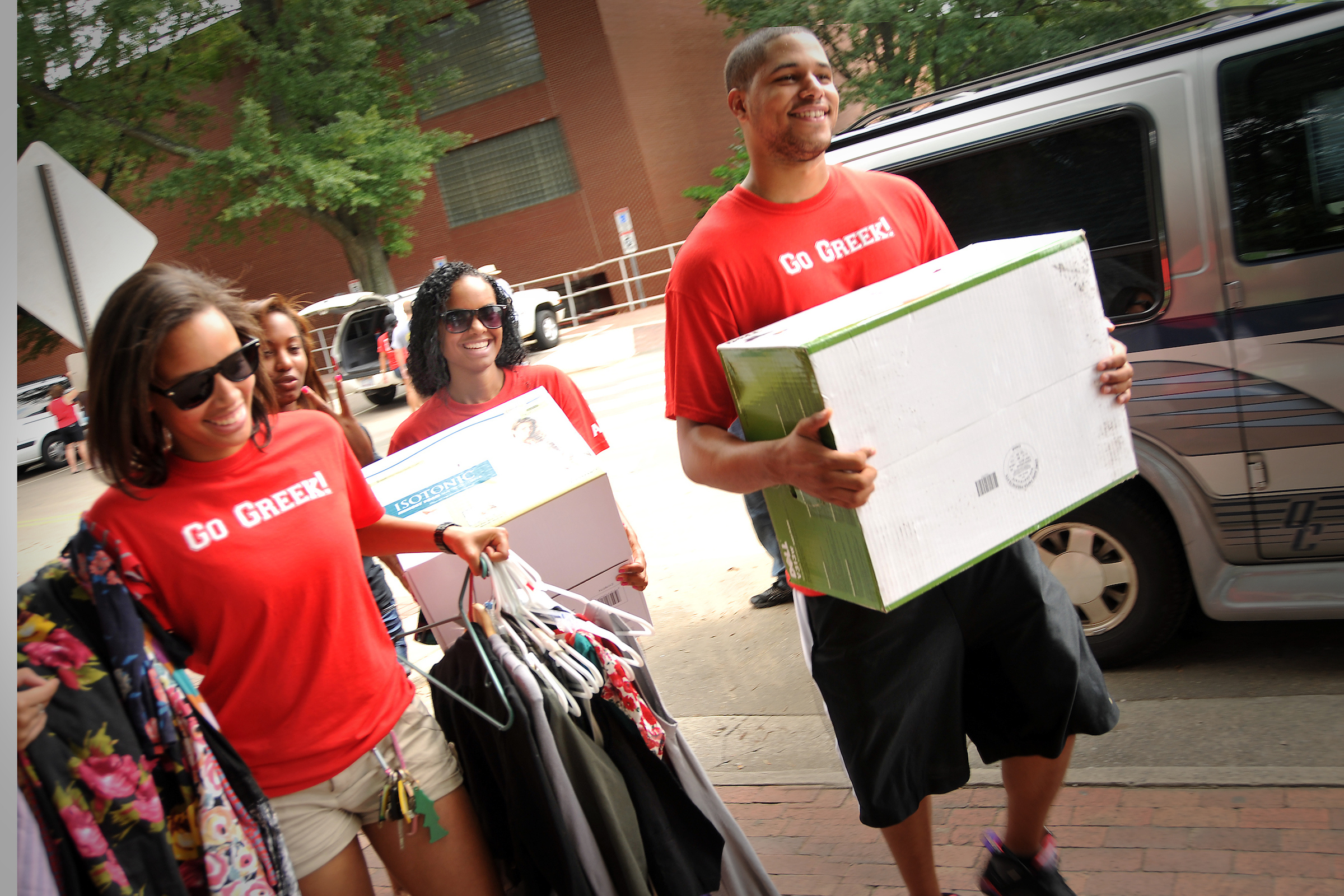 Fraternity and Sorority students help with move in to illstruate service opportunities on campus.