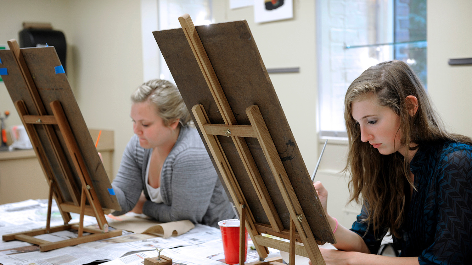 Students work on a painting during a class at the Craft Center in Thompson.