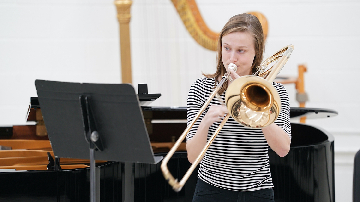 Emma Nussman playing a trombone