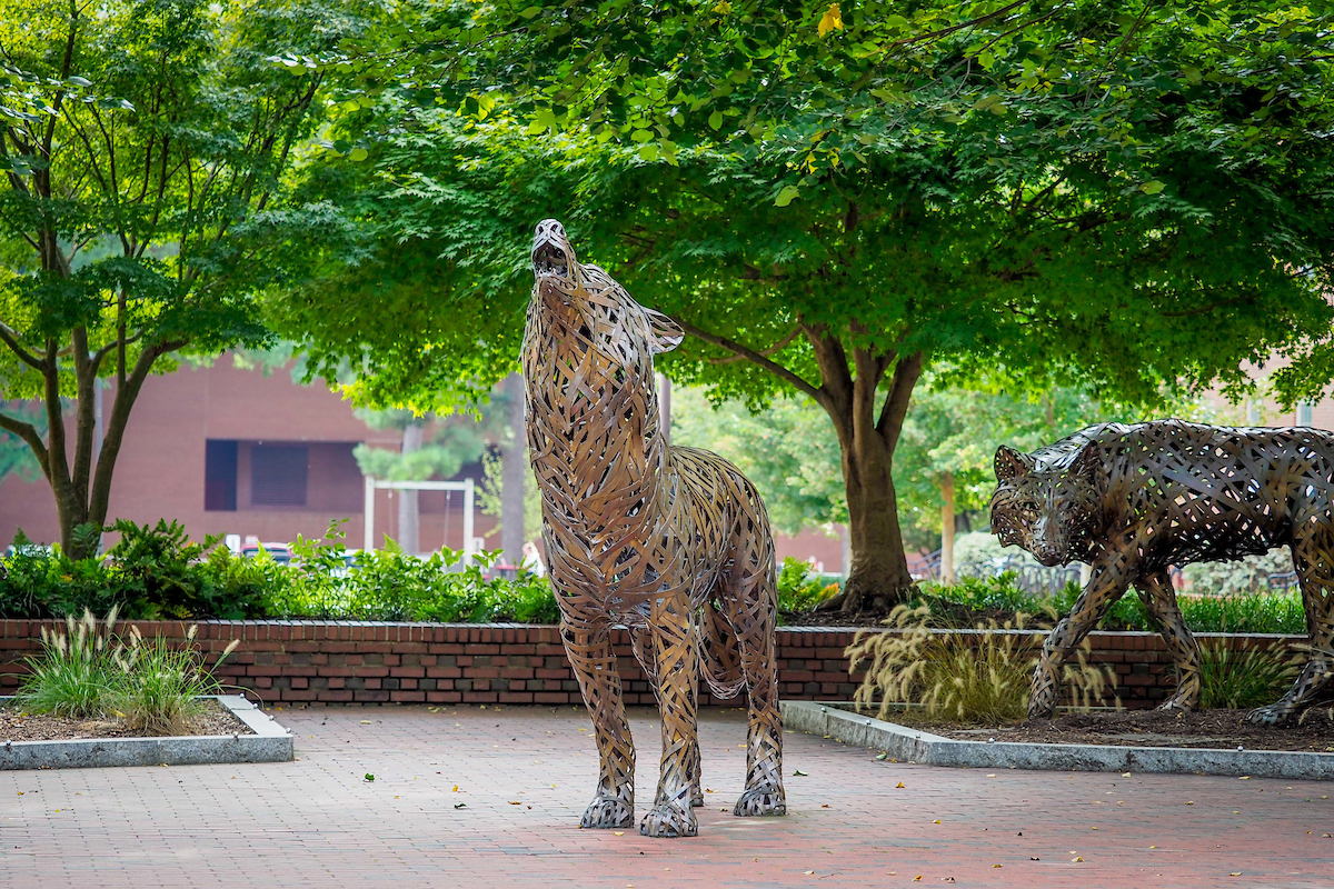 The copper wolves at Wolf Plaza near the Free Expression tunnel. Photo by Becky Kirkland.