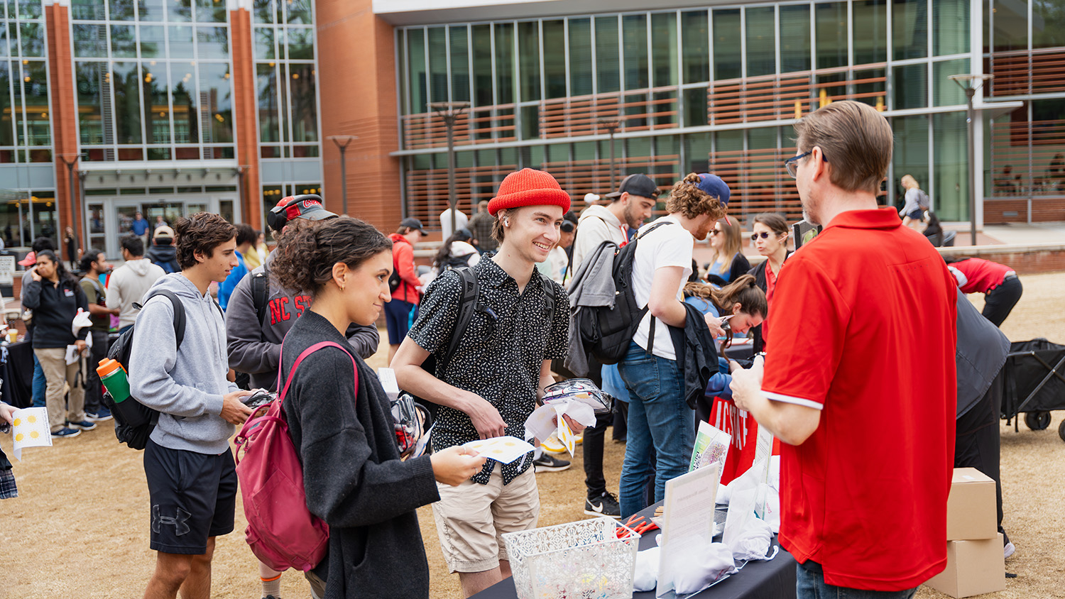NC State students gather on Stafford Commons for Campus Health's Safe Spring Break Fair.