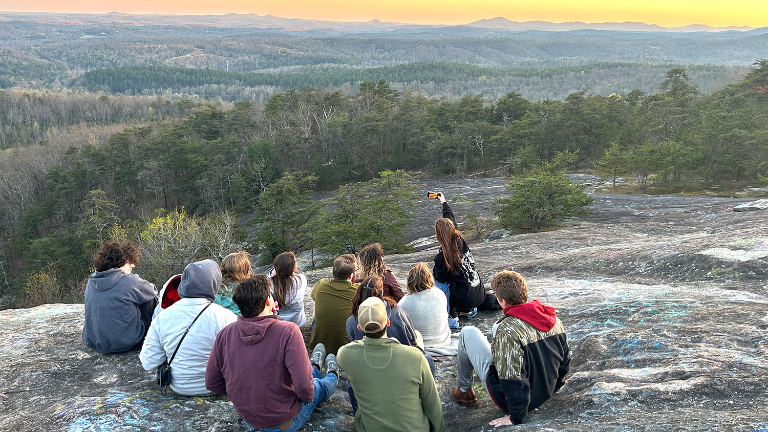 Students in NC State's Collegiate Recovery Community take in a mountain view on an overnight retreat.