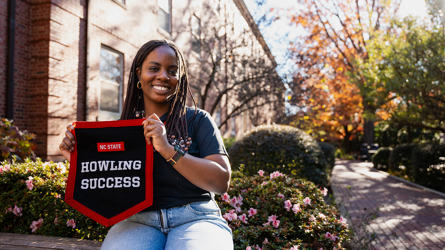 Ore Badejoh poses with her Howling Success banner.