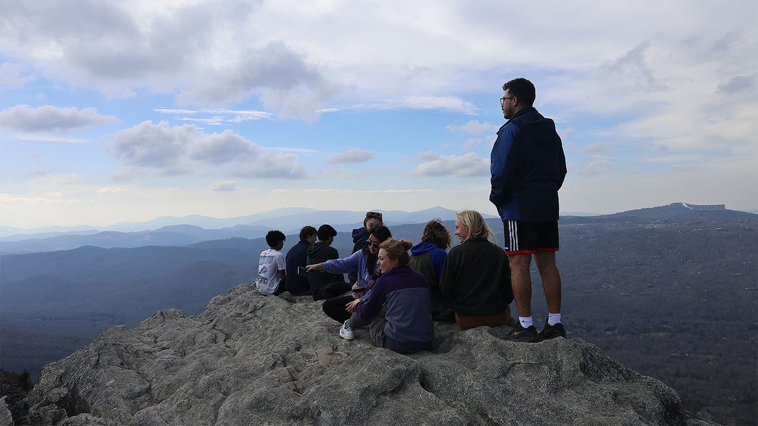 A group of students and other volunteers admire the view from the top of Grandfather Mountain in western North Carolina.